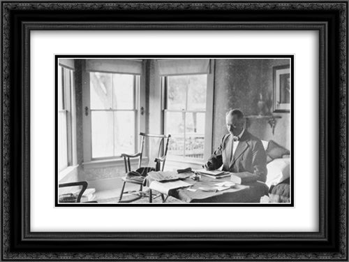President Calvin Coolidge, half-length portrait, seated at desk in family home in Rutland, Vt. 24x18 Black Ornate Wood Framed Art Print Poster with Double Matting by Library of Congress
