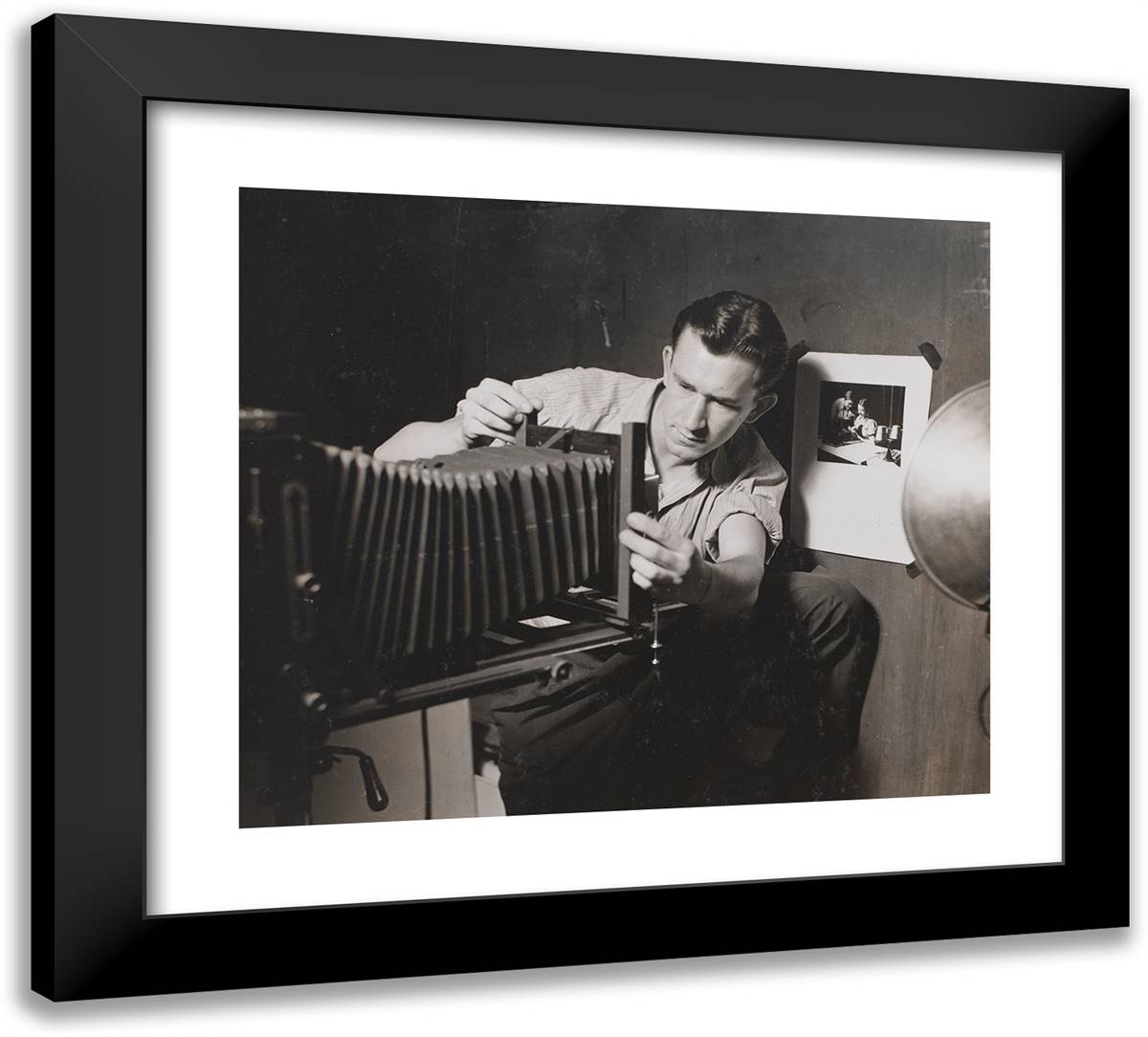 Man Adjusts Folding Bellows on a Large-Format Camera 22x20 Black Modern Wood Framed Art Print Poster by Eagle, Arnold