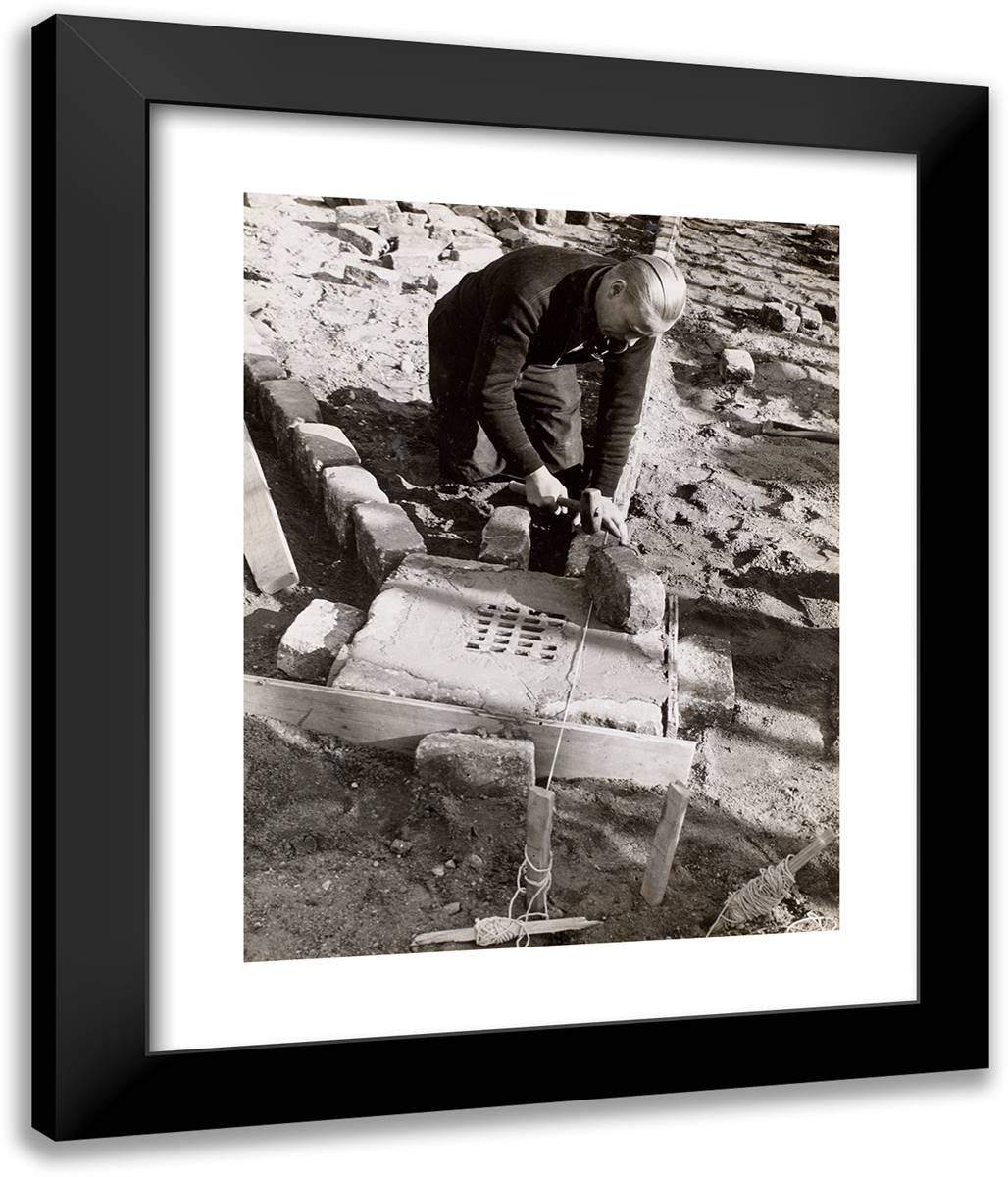 Man Kneels to Lay a Stone Foundation 20x24 Black Modern Wood Framed Art Print Poster by Eagle, Arnold