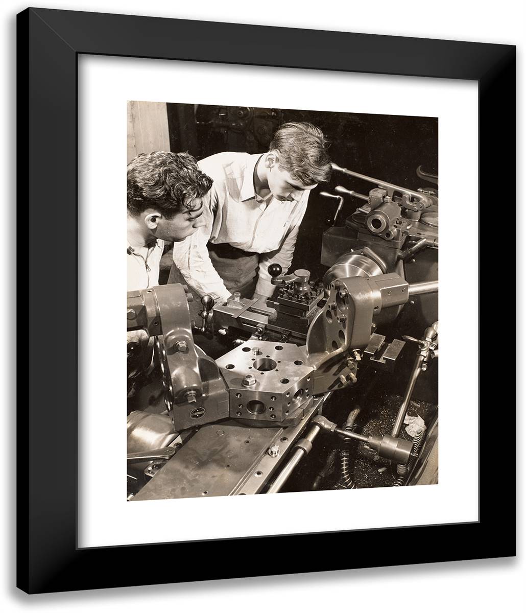 Two Young Men Stand Over a Piece of Machinery I 20x24 Black Modern Wood Framed Art Print Poster by Eagle, Arnold