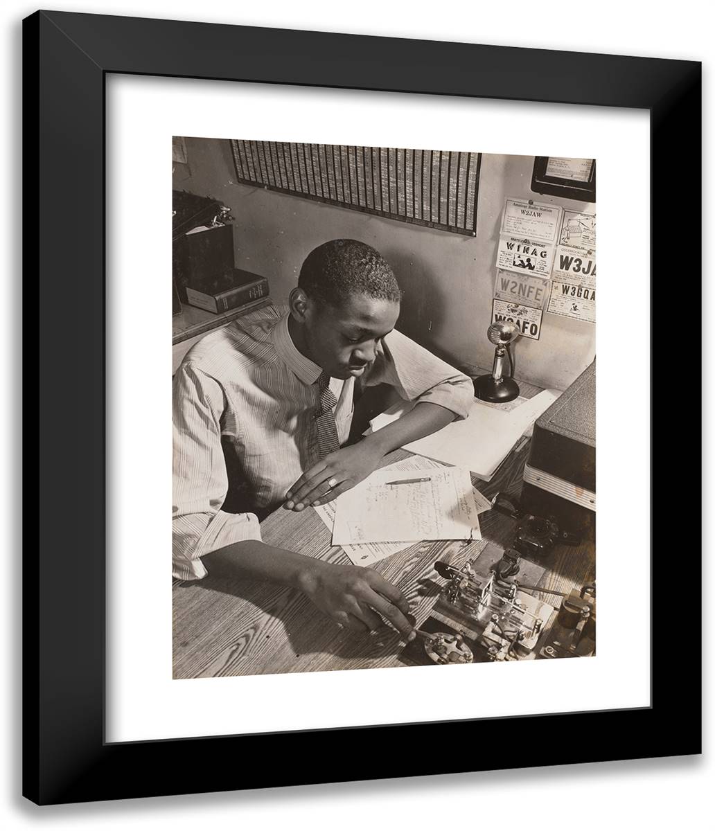 Young Man Sits at a Desk Reading Hand-Written Notes 20x24 Black Modern Wood Framed Art Print Poster by Eagle, Arnold