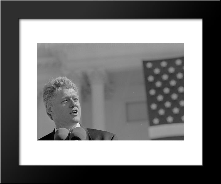 President Bill Clinton, Head-And-Shoulders Portrait, Speaking Into A Microphone In Front Of The U.S. Capitol 20x24 Black Modern Wood Framed Art Print Poster by Library of Congress