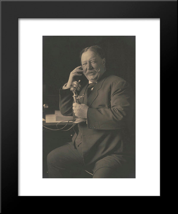 William Howard Taft, Three-Quarter-Length Portrait, Seated, Facing Front, Smiling While Talking On A Telephone 20x24 Black Modern Wood Framed Art Print Poster by Library of Congress