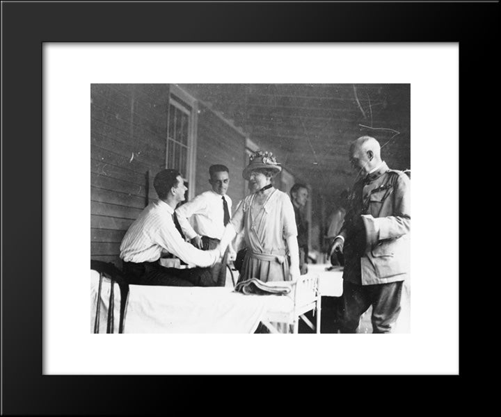 Mrs. Warren G. Harding Shaking Hands With Man Seated On Bed In Military Barracks(?) 20x24 Black Modern Wood Framed Art Print Poster by Library of Congress