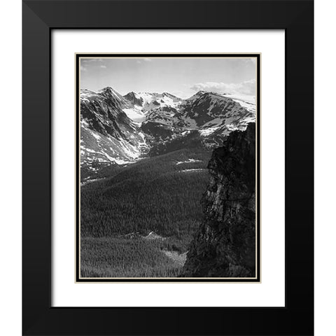 View of snow-capped mountain timbered area below, in Rocky Mountain National Park, Colorado, ca. 194 Black Modern Wood Framed Art Print with Double Matting by Adams, Ansel