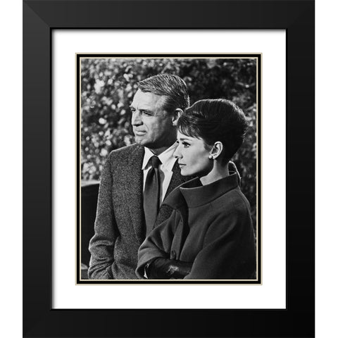 Cary Grant with Audrey Hepburn - Charade Black Modern Wood Framed Art Print with Double Matting by Hollywood Photo Archive