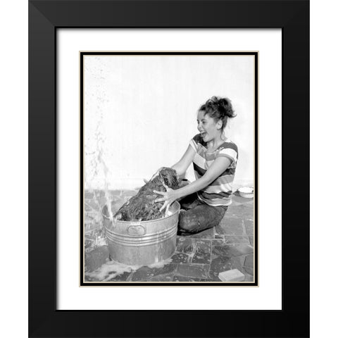Elizabeth Taylor washing a dog Black Modern Wood Framed Art Print with Double Matting by Hollywood Photo Archive