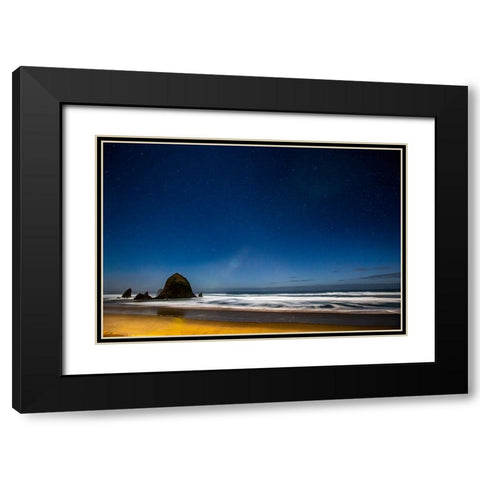 USA- Oregon. Cannon Beach and Haystack Rock stars showing during blue light. Black Modern Wood Framed Art Print with Double Matting by Gulin, Darrell