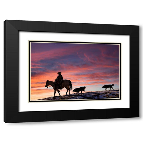 USA- Shell- Wyoming. Hideout Ranch cowgirl and her two dogs horseback riding at sunset. Black Modern Wood Framed Art Print with Double Matting by Gulin, Darrell