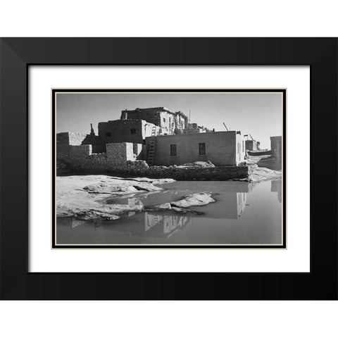 Adobe House with Water in Foreground - Acoma Pueblo, New Mexico - National Parks and Monuments, ca. Black Modern Wood Framed Art Print with Double Matting by Adams, Ansel