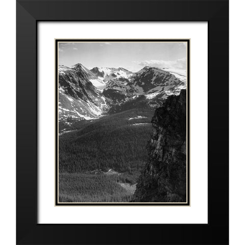 View of snow-capped mountain timbered area below, in Rocky Mountain National Park, Colorado, ca. 194 Black Modern Wood Framed Art Print with Double Matting by Adams, Ansel