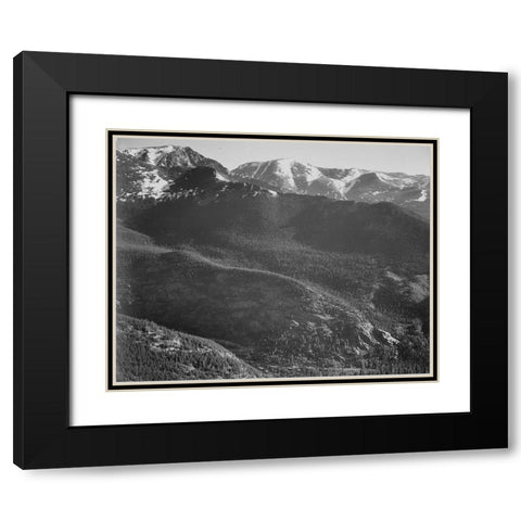 View of wooded hills with mountains in background, in Rocky Mountain National Park, Colorado, ca. 19 Black Modern Wood Framed Art Print with Double Matting by Adams, Ansel