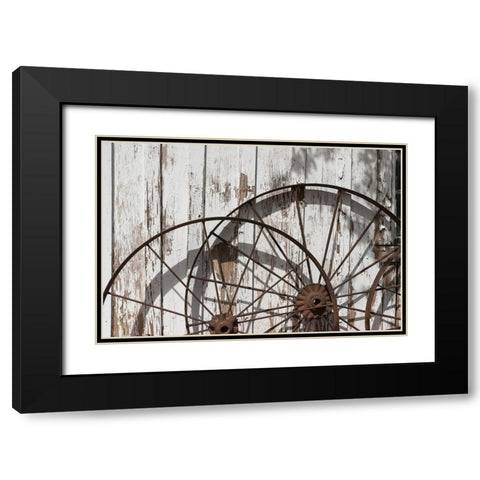 Old wagon wheels against a shed in Buffalo Gap Historic Village, near Abilene, TX Black Modern Wood Framed Art Print with Double Matting by Highmith, Carol