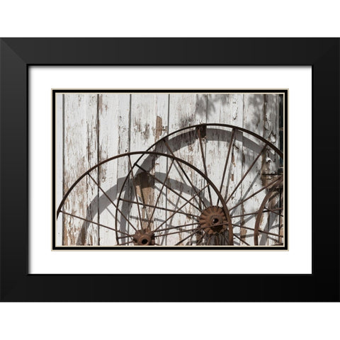 Old wagon wheels against a shed in Buffalo Gap Historic Village, near Abilene, TX Black Modern Wood Framed Art Print with Double Matting by Highmith, Carol