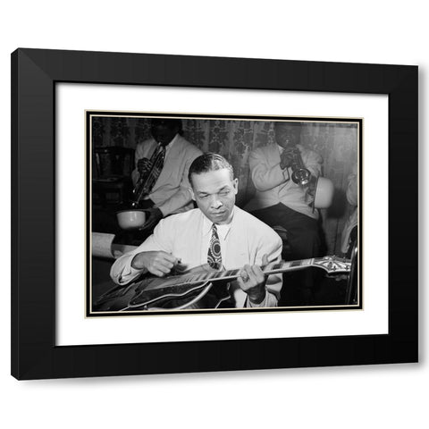 Fred Guy playing guitar at the Aquarium-New York 1946 Black Modern Wood Framed Art Print with Double Matting by Gottlieb, William