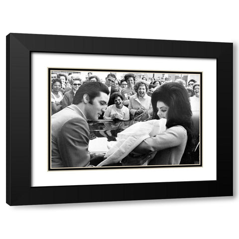 Elvis Presley and Priscilla with Lisa Marie-1968 Black Modern Wood Framed Art Print with Double Matting by Vintage Music Archive