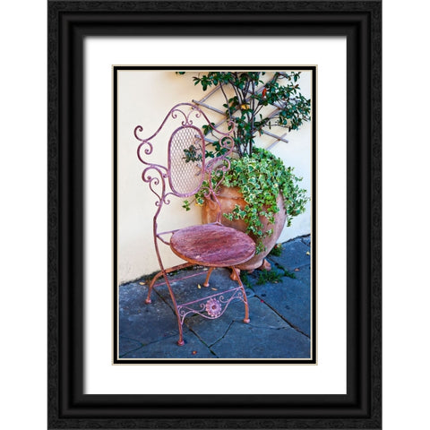 Italy-Tuscany-Lucca Decorative chair and potted plant outside a shop Piazza dellAnfiteatro Romano Black Ornate Wood Framed Art Print with Double Matting by Eggers, Julie