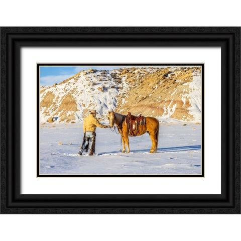USA- Wyoming. Hideout Horse Ranch- wrangler and horse in snow. Black Ornate Wood Framed Art Print with Double Matting by Looney, Hollice