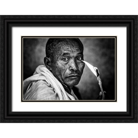 Ethiopian Man Holding A Lit Candle In A Religious Ceremony. Black Ornate Wood Framed Art Print with Double Matting by Inazio Kuesta, Joxe