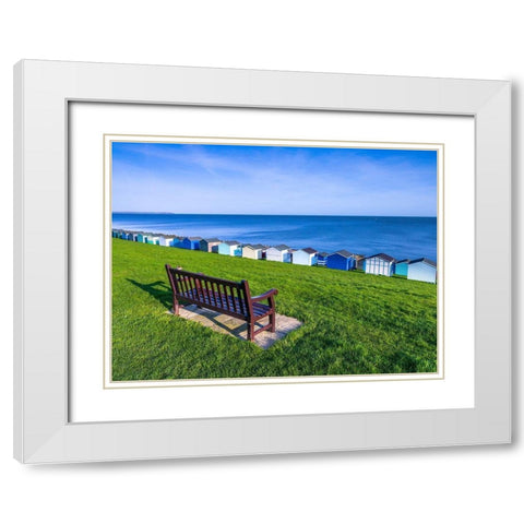 Bench on lawn with beach huts in background White Modern Wood Framed Art Print with Double Matting by Frank, Assaf