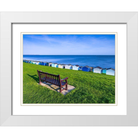 Bench on lawn with beach huts in background White Modern Wood Framed Art Print with Double Matting by Frank, Assaf