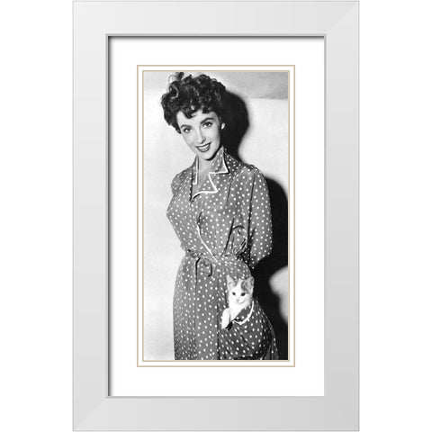 Elizabeth Taylor with a kitten in her pocket White Modern Wood Framed Art Print with Double Matting by Hollywood Photo Archive