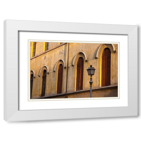 Italy-Tuscany-Lucca Street lamppost and arched windows with wooden shutters White Modern Wood Framed Art Print with Double Matting by Eggers, Julie