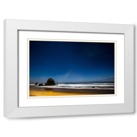 USA- Oregon. Cannon Beach and Haystack Rock stars showing during blue light. White Modern Wood Framed Art Print with Double Matting by Gulin, Darrell