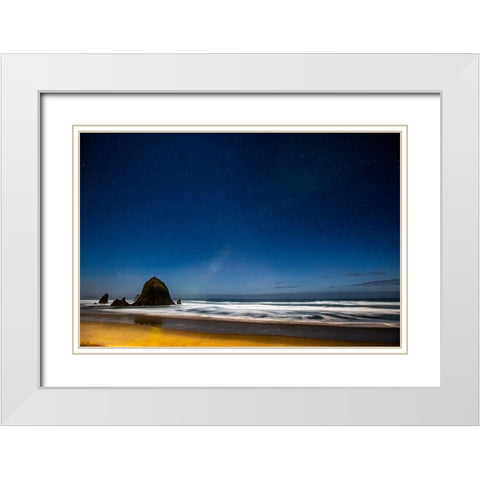 USA- Oregon. Cannon Beach and Haystack Rock stars showing during blue light. White Modern Wood Framed Art Print with Double Matting by Gulin, Darrell
