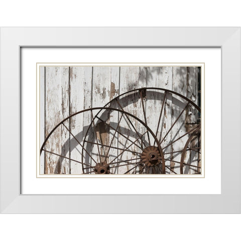 Old wagon wheels against a shed in Buffalo Gap Historic Village, near Abilene, TX White Modern Wood Framed Art Print with Double Matting by Highmith, Carol