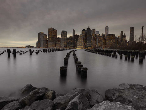 Manhattan skyline with rows of groynes in East river, New York Black Ornate Wood Framed Art Print with Double Matting by Frank, Assaf