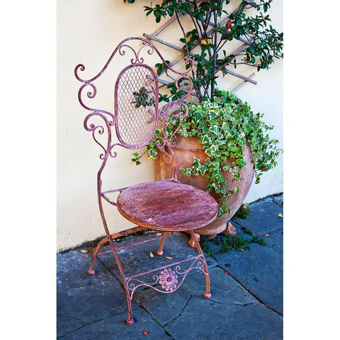 Italy-Tuscany-Lucca Decorative chair and potted plant outside a shop Piazza dellAnfiteatro Romano Black Modern Wood Framed Art Print with Double Matting by Eggers, Julie