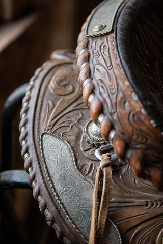 USA-Colorado-Custer County-Westcliffe-Music Meadows Ranch Tack room Tooled leather western saddle Black Ornate Wood Framed Art Print with Double Matting by Hopkins, Cindy Miller