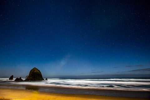 USA- Oregon. Cannon Beach and Haystack Rock stars showing during blue light. Black Modern Wood Framed Art Print by Gulin, Darrell
