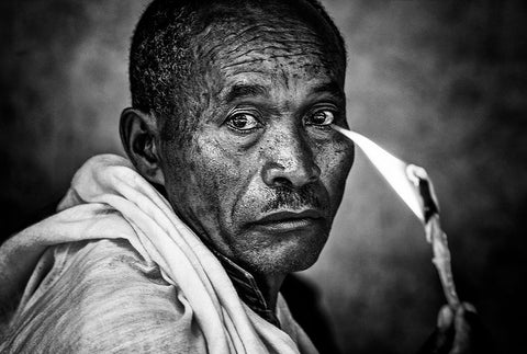 Ethiopian Man Holding A Lit Candle In A Religious Ceremony. Black Ornate Wood Framed Art Print with Double Matting by Inazio Kuesta, Joxe