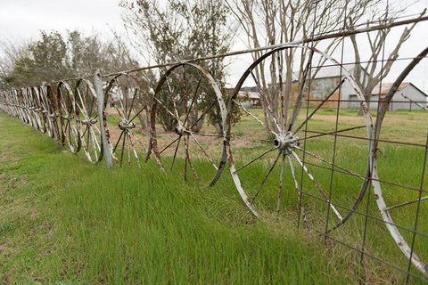 A fence made of wagon wheels near Schulenburg in Fayette County, TX White Modern Wood Framed Art Print with Double Matting by Highmith, Carol