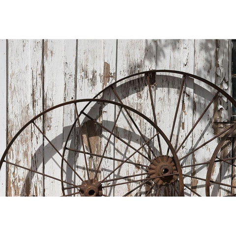 Old wagon wheels against a shed in Buffalo Gap Historic Village, near Abilene, TX White Modern Wood Framed Art Print by Highmith, Carol