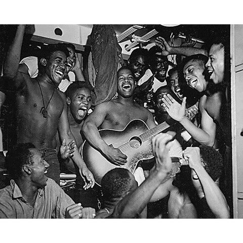 WWII men aboard the U.S.S. Ticonderoga hear the news of Japans surrender Black Modern Wood Framed Art Print with Double Matting by U.S. Archives