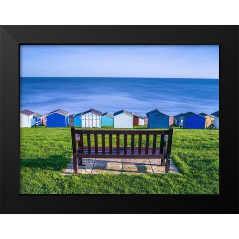 Bench on lawn with beach huts in background Black Modern Wood Framed Art Print by Frank, Assaf
