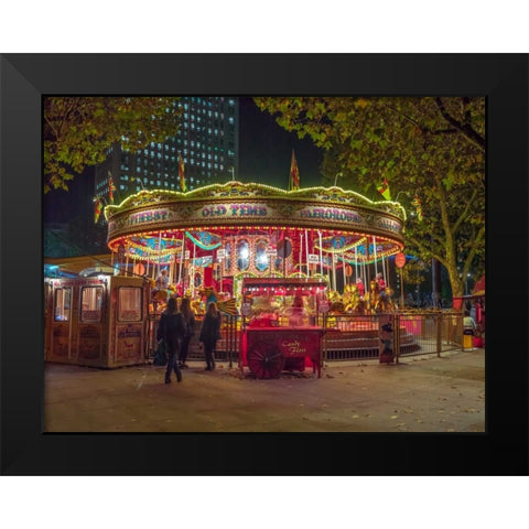 Spinning carousel at night in garden, London, UK Black Modern Wood Framed Art Print by Frank, Assaf