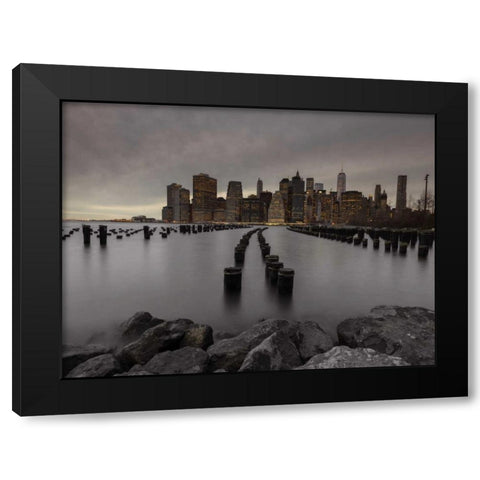 Manhattan skyline with rows of groynes in East river, New York Black Modern Wood Framed Art Print by Frank, Assaf