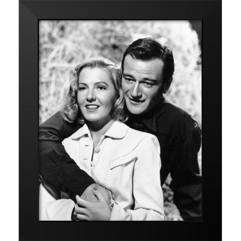 John Wayne with Jean Arthur Black Modern Wood Framed Art Print by Hollywood Photo Archive