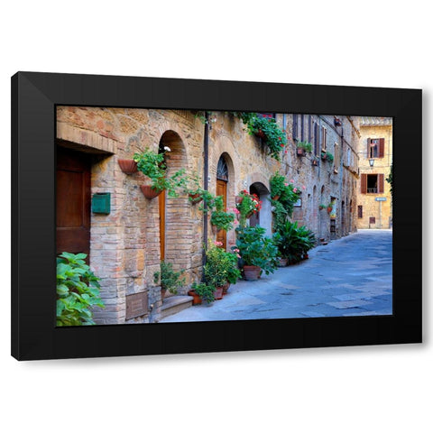 Italy-Tuscany-Pienza Flower pots and potted plants decorate a narrow street in a Tuscany village Black Modern Wood Framed Art Print by Eggers, Julie