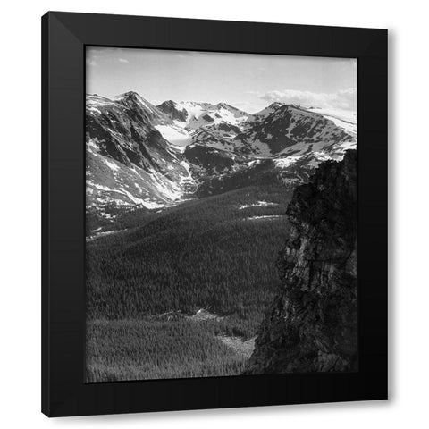 View of snow-capped mountain timbered area below, in Rocky Mountain National Park, Colorado, ca. 194 Black Modern Wood Framed Art Print by Adams, Ansel