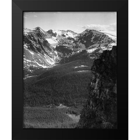 View of snow-capped mountain timbered area below, in Rocky Mountain National Park, Colorado, ca. 194 Black Modern Wood Framed Art Print by Adams, Ansel