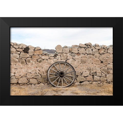 Wagon wheel against a stone fence at Hueco Tanks State Park, northwest of El Paso, TX Black Modern Wood Framed Art Print by Highmith, Carol