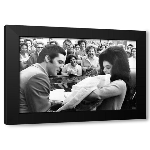Elvis Presley and Priscilla with Lisa Marie-1968 Black Modern Wood Framed Art Print with Double Matting by Vintage Music Archive