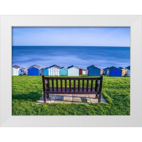 Bench on lawn with beach huts in background White Modern Wood Framed Art Print by Frank, Assaf