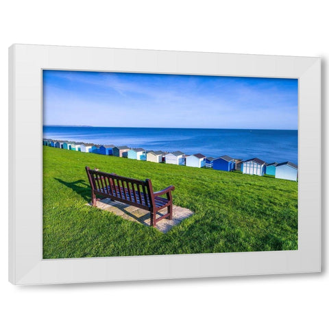 Bench on lawn with beach huts in background White Modern Wood Framed Art Print by Frank, Assaf