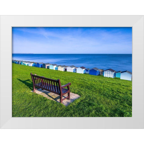 Bench on lawn with beach huts in background White Modern Wood Framed Art Print by Frank, Assaf